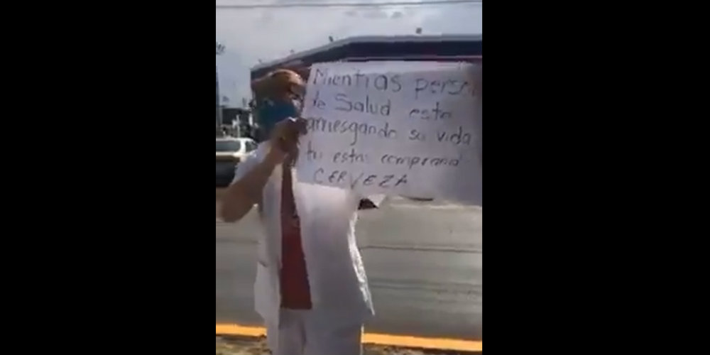 Enfermera llora al ver las filas para comprar cerveza